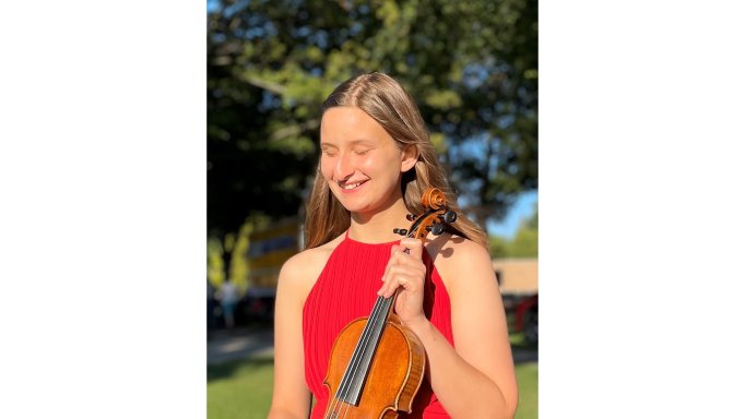 Julia LaGrand holding her violin